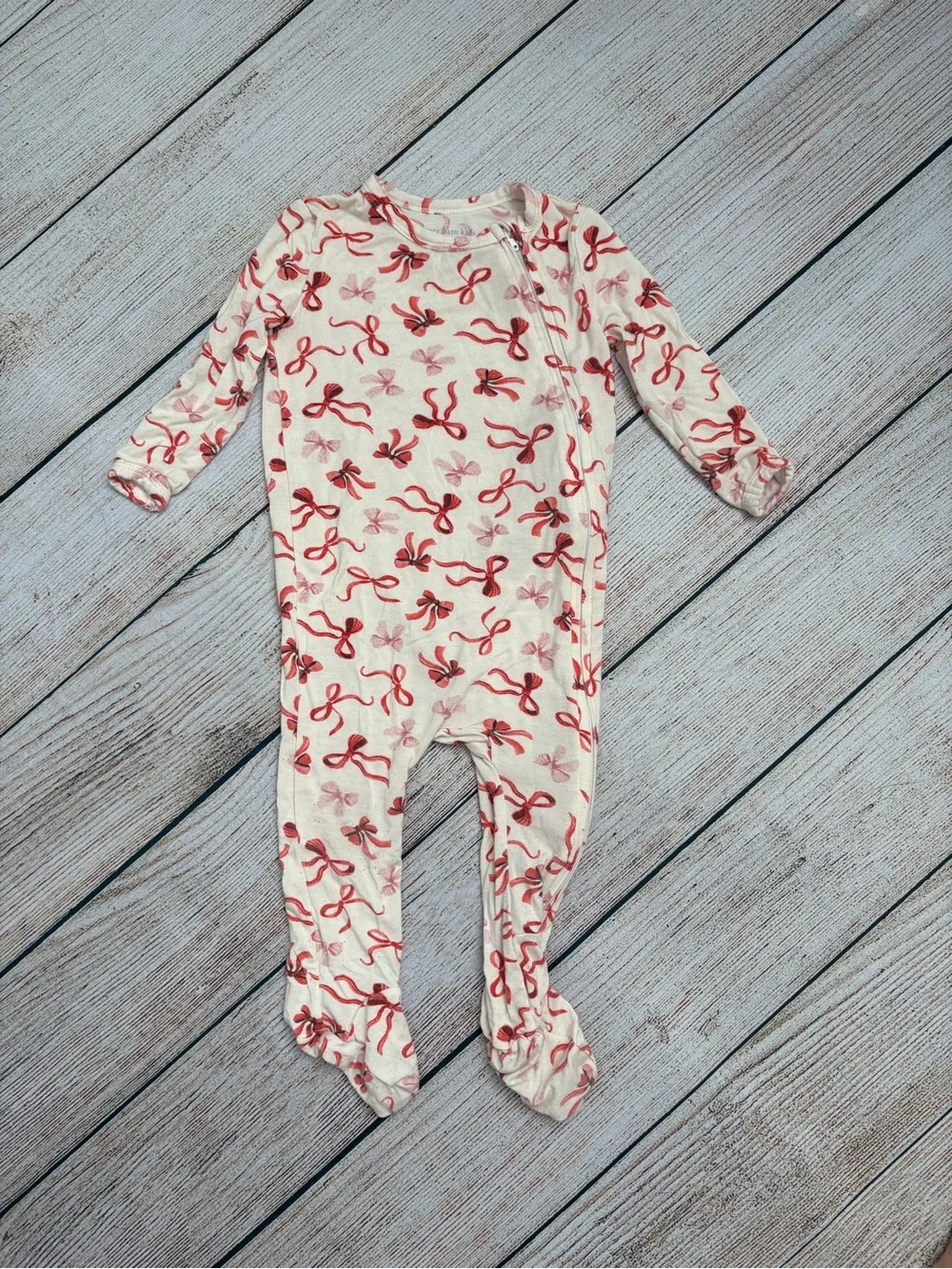 Pottery Barn Kids Long-Sleeve Footed One-Piece with Red Bow Print